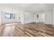 This spacious room features hardwood floors, recessed lighting, and an open floor plan at 7351 S Marion St, Centennial, CO 80122