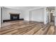 Bright living room features a brick fireplace and hard wood floors at 7351 S Marion St, Centennial, CO 80122