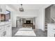Open living space with hardwood floors, modern railing, and plenty of natural light at 7351 S Marion St, Centennial, CO 80122