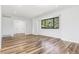 Hardwood floors, recessed lighting, and a large window create a bright atmosphere in this room at 7351 S Marion St, Centennial, CO 80122