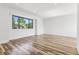 Bright, expansive room showcases hardwood floors, recessed lighting, and a large window at 7351 S Marion St, Centennial, CO 80122