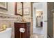 Stylish bathroom features granite countertop, tiled walls, and modern fixtures creating a spa-like retreat at 775 Poppywood Dr, Highlands Ranch, CO 80126