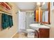 Bathroom with a glass door shower, ceramic tiled floors, and a wooden vanity at 775 Poppywood Dr, Highlands Ranch, CO 80126