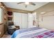 Cozy bedroom featuring carpeting, a ceiling fan, a double closet and ample lighting at 775 Poppywood Dr, Highlands Ranch, CO 80126