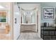 Walk through dressing room featuring built in mirrors, shelving, and vanity area at 775 Poppywood Dr, Highlands Ranch, CO 80126
