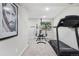 Home gym featuring exercise equipment including a treadmill and a weight bench at 775 Poppywood Dr, Highlands Ranch, CO 80126
