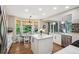 Bright kitchen features an island, stainless steel appliances, and a cozy breakfast nook at 775 Poppywood Dr, Highlands Ranch, CO 80126