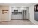 Modern kitchenette equipped with stainless steel appliances and sleek gray cabinetry at 775 Poppywood Dr, Highlands Ranch, CO 80126