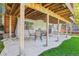 Shaded outdoor patio under the deck offers additional seating area at 775 Poppywood Dr, Highlands Ranch, CO 80126