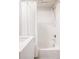 Modern bathroom with white subway tile, tub, shower and updated fixtures at 3145 W 19Th Ave, Denver, CO 80204