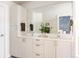 Bright bathroom with dual sinks, modern cabinets, and a large mirror, blending style and functionality at 3145 W 19Th Ave, Denver, CO 80204