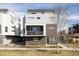Modern three-story home with a balcony and rooftop deck, showcasing contemporary design elements at 3145 W 19Th Ave, Denver, CO 80204