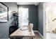 Cozy home office space with a wooden desk, a bookshelf and natural light filtering through the window at 3145 W 19Th Ave, Denver, CO 80204