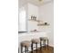 Bright kitchen with barstool seating at the counter, perfect for casual dining and entertaining guests at 3145 W 19Th Ave, Denver, CO 80204