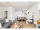 Open-concept living area flowing into a modern kitchen, offering a spacious and airy atmosphere at 3145 W 19Th Ave, Denver, CO 80204