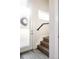 Contemporary staircase with wood treads, white risers, and a frosted glass door for privacy and style at 3145 W 19Th Ave, Denver, CO 80204