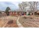 Exterior rear view of home, stone pathway leading to building at 2885 S Gilpin St, Denver, CO 80210