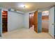 Unfinished basement area with open closet space and open doorway leading to additional room at 2885 S Gilpin St, Denver, CO 80210