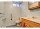 Bathroom with accessible grab bars, sink, and window at 2885 S Gilpin St, Denver, CO 80210
