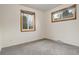 Carpeted bedroom featuring two windows for natural light at 2885 S Gilpin St, Denver, CO 80210