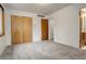 Cozy bedroom with new carpeting, a closet, and neutral paint at 2885 S Gilpin St, Denver, CO 80210