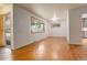 Bright living room featuring hardwood floors, neutral walls, and large windows at 2885 S Gilpin St, Denver, CO 80210