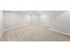 The finished basement boasts neutral walls, plush carpeting, and ample space, creating a cozy and versatile area at 8777 Whiteclover St, Littleton, CO 80125