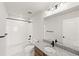 Clean, modern bathroom with tub shower and vanity at 8777 Whiteclover St, Littleton, CO 80125