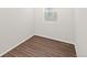 Bedroom with light-colored walls and hardwood floors at 8777 Whiteclover St, Littleton, CO 80125