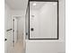 Glass enclosed shower with dark fixtures and subway tiling at 8777 Whiteclover St, Littleton, CO 80125