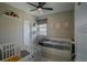 Spacious Bedroom features a crib, daybed, and built-in storage, offering a comfortable space at 10018 E 62Nd Ave, Denver, CO 80238