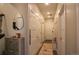Hallway features storage, coat closet, decor and access to the home's entry at 10018 E 62Nd Ave, Denver, CO 80238
