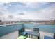 Outdoor rooftop deck area with seating and panoramic views of the city skyline at 10018 E 62Nd Ave, Denver, CO 80238