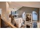 Open concept design overlooking a living area featuring a cozy fireplace, natural light and views at 13076 Marion Dr, Thornton, CO 80241