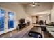 Spacious living room with vaulted ceilings, hardwood floors, comfortable seating, and exterior access at 13076 Marion Dr, Thornton, CO 80241