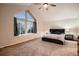 Bright main bedroom with an extra large window, vaulted ceiling, and modern decor at 13076 Marion Dr, Thornton, CO 80241