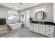 Elegant bathroom with soaking tub and double vanity offers a luxurious and relaxing experience at 6400 Barnstead Dr, Castle Pines, CO 80108
