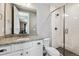 Modern bathroom with granite countertop vanity and glass-enclosed shower offers style and functionality at 6400 Barnstead Dr, Castle Pines, CO 80108