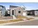Charming two-story home featuring a stone facade, front yard, and inviting curb appeal at 6400 Barnstead Dr, Castle Pines, CO 80108