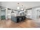 Spacious kitchen with large island, stainless steel appliances, and modern finishes at 6400 Barnstead Dr, Castle Pines, CO 80108