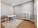 Home office with light walls, a desk, a chair, and a glass cabinet on a fluffy white rug at 6400 Barnstead Dr, Castle Pines, CO 80108
