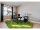Bright office space with ample natural light, modern desk, chair, and shelving, ideal for productivity at 6400 Barnstead Dr, Castle Pines, CO 80108
