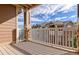 Private balcony with railings and posts with stone detail at 7440 S Blackhawk St # 12-204, Englewood, CO 80112