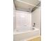 Bathroom with a shower over tub and white tile surround at 7440 S Blackhawk St # 12-204, Englewood, CO 80112