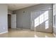 Neutral bedroom featuring light-colored walls, wood-look floors, a large closet, and natural light at 7440 S Blackhawk St # 12-204, Englewood, CO 80112