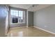 Empty bedroom featuring a large window with view and wood-look floors at 7440 S Blackhawk St # 12-204, Englewood, CO 80112
