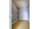 Walk-in closet featuring wire shelving and wood-look floors at 7440 S Blackhawk St # 12-204, Englewood, CO 80112