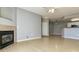 Comfortable living room with a fireplace and a view of the adjacent kitchen area at 7440 S Blackhawk St # 12-204, Englewood, CO 80112