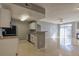 Spacious open living space combining kitchen, dining, and living room areas at 7440 S Blackhawk St # 12-204, Englewood, CO 80112