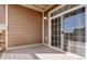 Relaxing private outdoor patio with sliding glass doors and neutral finishes at 7440 S Blackhawk St # 12-204, Englewood, CO 80112